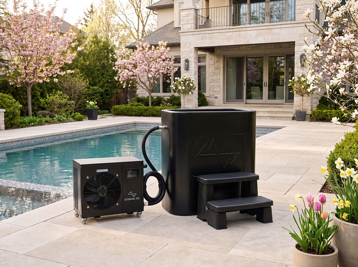 Eternal Ice HD Ultimate cold plunge tub with Power Chiller and step on a backyard patio, showing a complete bundle setup ready for outdoor use.