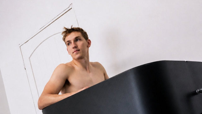 Lane Hutson standing in his Eternal Ice HD Ultimate ice bath at home