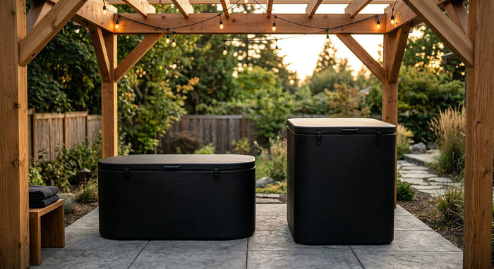 Side-by-side comparison of a lay down cold plunge tub and a vertical cold plunge tub with lids under a cedar pergola on a backyard patio