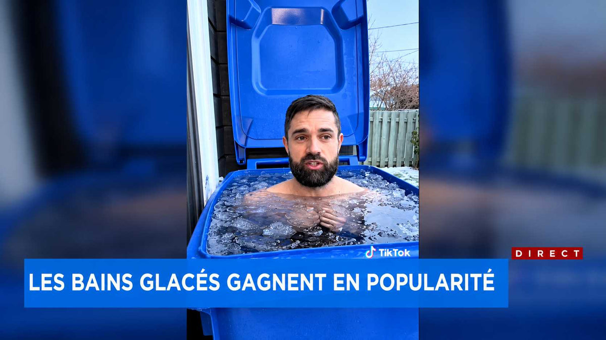 Pierre-Luc Corriveau, co-founder of Eternal Ice Bath, sitting in a recycling bin filled with ice water during a TVA Nouvelles report on the rise of ice baths, February 23, 2024