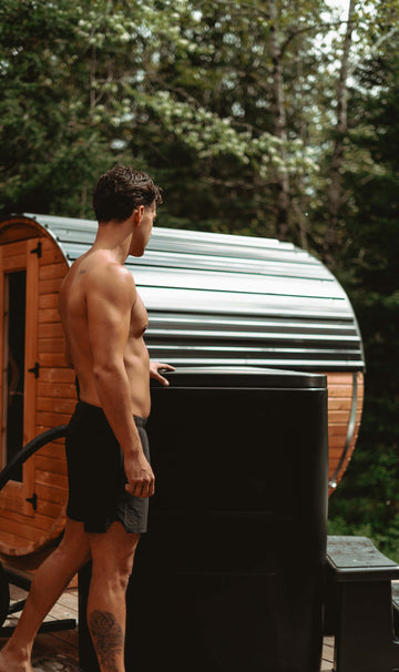 A model contemplating their art piece: the Eternal Ice HD Ultimate Ice Bath.