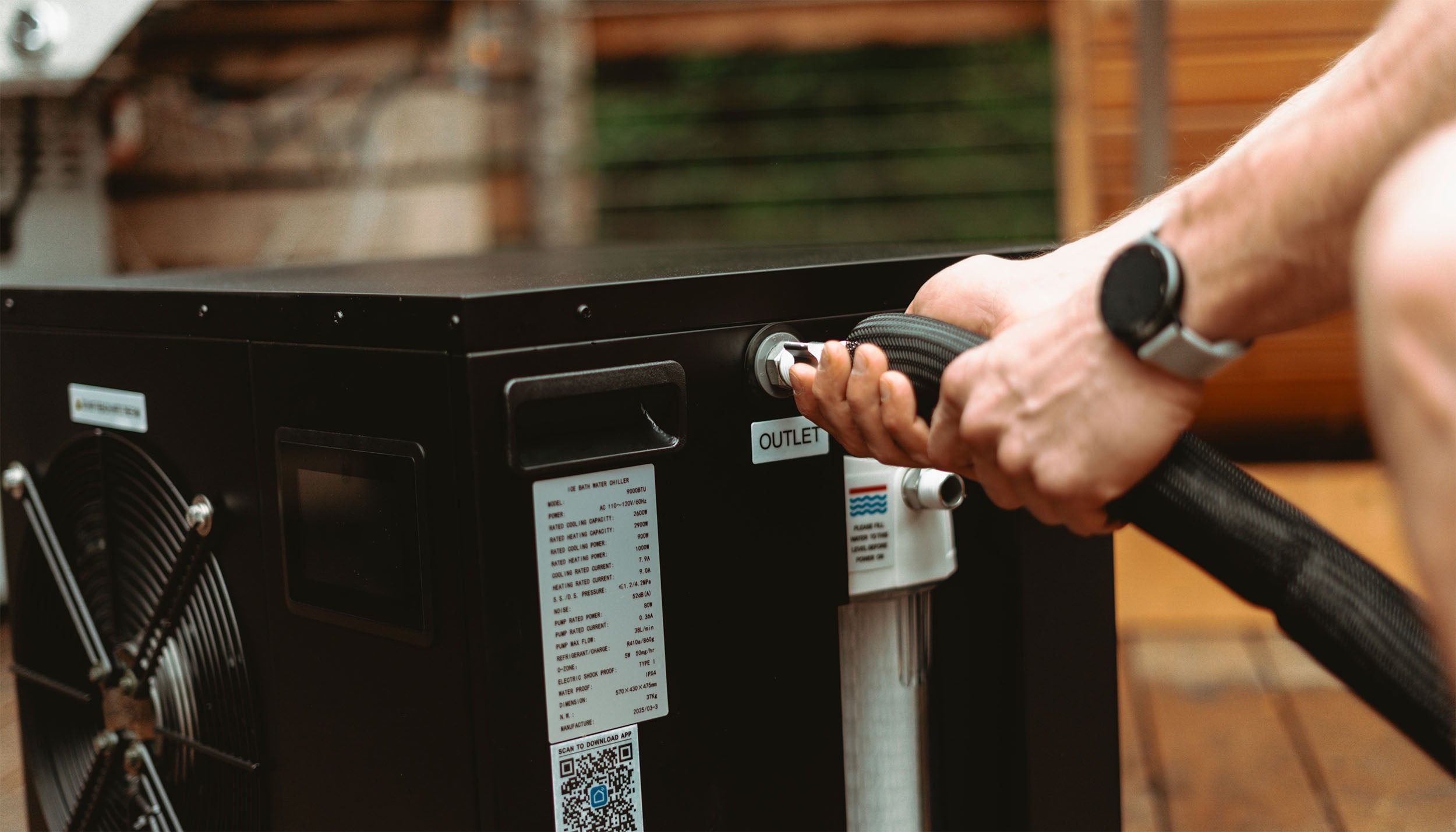 User connecting premium hose to Eternal Ice Chiller for cold plunge setup