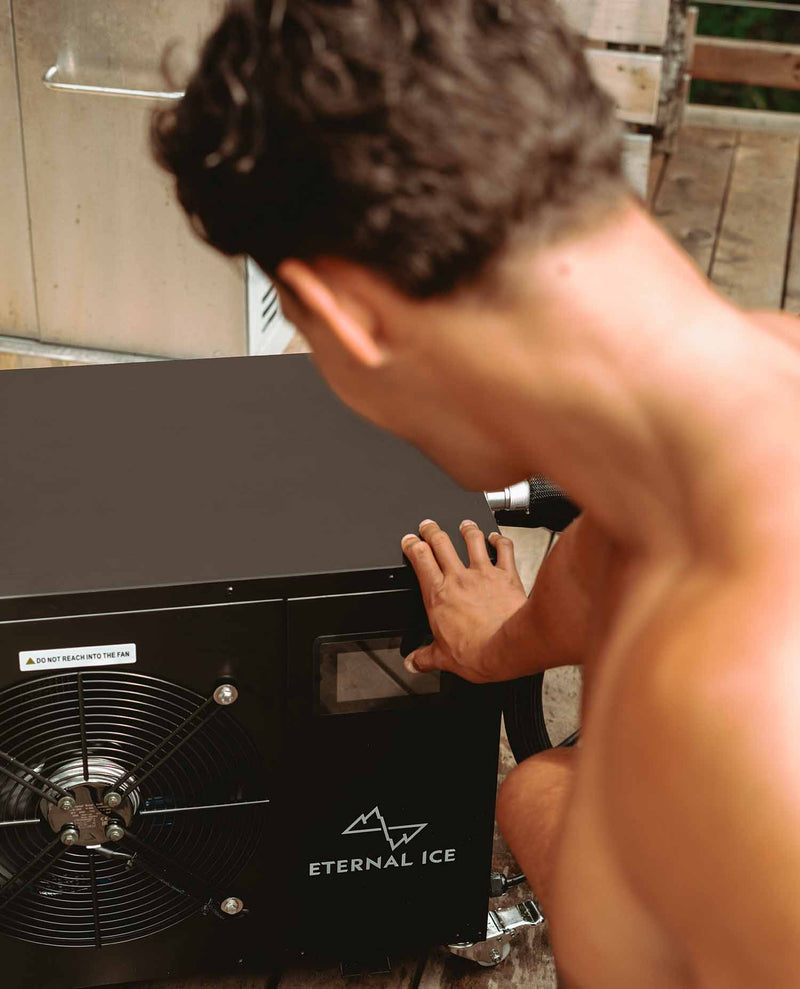 Person activating Eternal Ice Power 1 HP cold plunge chiller – starting high-performance unit for glacier-cold water therapy
